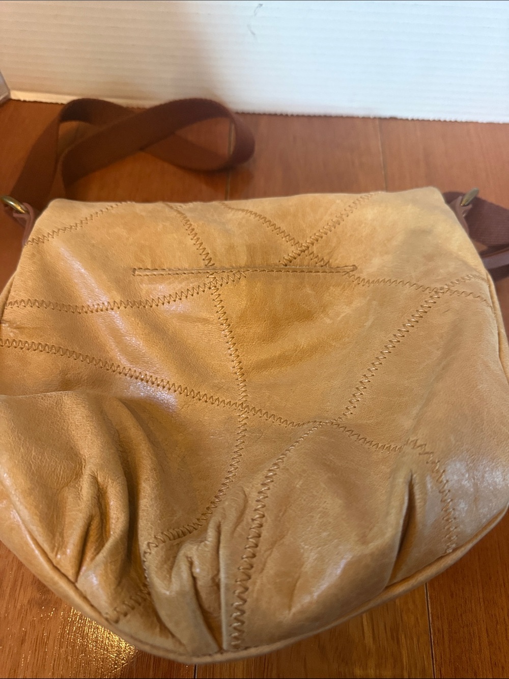 The Sak Deena fold-over crescent crossbody bag. tan leather peace sign stitch - Picture 5 of 11